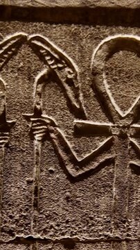 Hieroglyphs and images of Egyptian gods at the Ancient Egyptian Temple of Edfu. Edfu is the site of a Ptolemaic-era Temple of Horus and an ancient settlement in Egypt