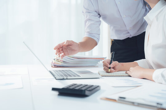 Woman hands typing on computer keyboard in modern office setting at work