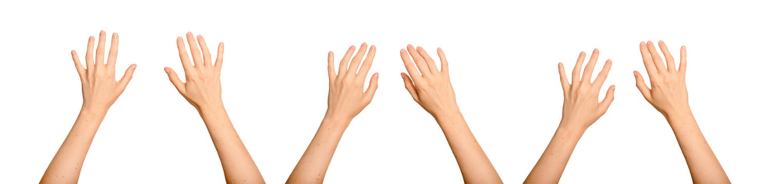 Two female hands stretching toward an unseen digital surface. Palms open as if engaging with virtual