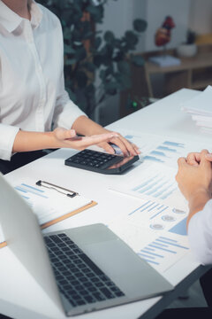 economic concepts Business and partner plan data analysis to determine the direction of the company's business investment in the workplace. Night Marketing Consultant Concept