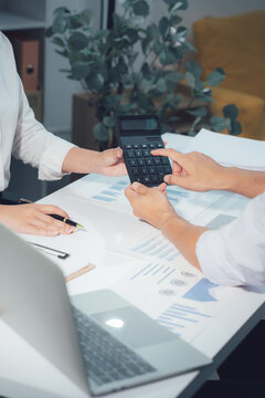 economic concepts Business and partner plan data analysis to determine the direction of the company's business investment in the workplace. Night Marketing Consultant Concept
