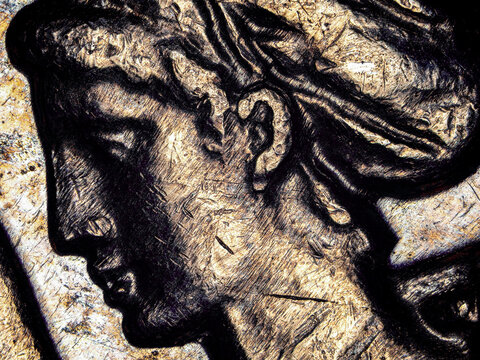 Engraved female profile on a 1974 French 50 francs coin under microscope