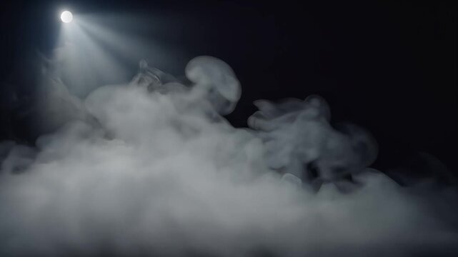 Dramatic white smoke clouds illuminated by single spotlight beam against dark background