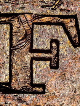 Engraved letter F on a 1974 French 50 francs coin under microscope