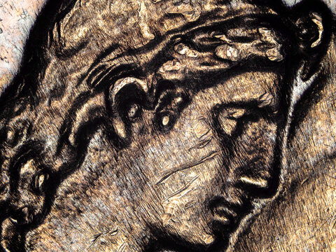 Engraved female portrait on a French 50 francs coin from 1974 under microscope