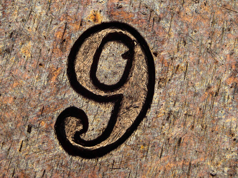 Engraved number 9 on a 1974 French 50 francs coin under microscope