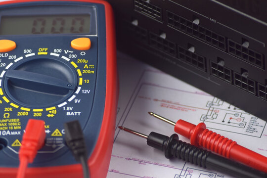 The digital multimeter electrical engineering drawings, circuit breaker and pencils