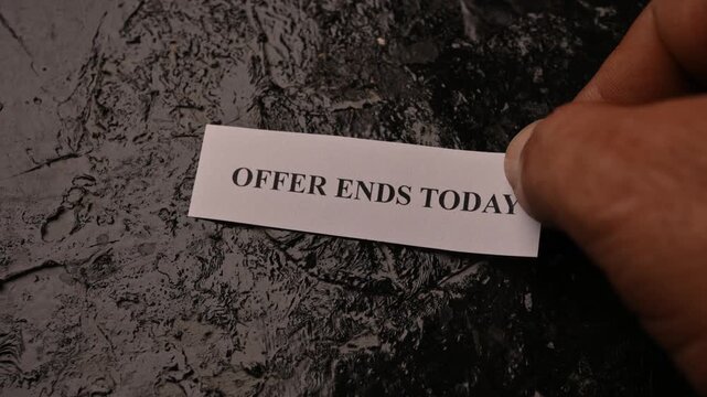 Offer Ends Today Urgency Promotion Card Placed by Hand on Rough Stone Texture Background