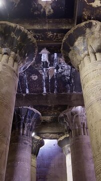Temple of Edfu with massive carved columns and detailed hieroglyphs, revealing the atmosphere of Ancient Egyptian architecture and sacred space. Egypt