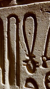 Hieroglyphs and images of Egyptian gods at the Ancient Egyptian Temple of Edfu. Edfu is the site of a Ptolemaic-era Temple of Horus and an ancient settlement in Egypt