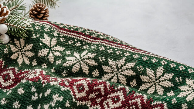 Close up texture of knitted Christmas jumper with winter pattern