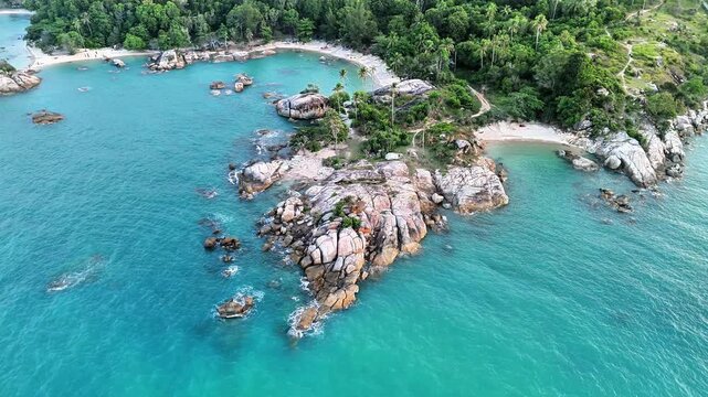 Aerial drone panorama of Teluk Karang Beach Bangka featuring turquoise ocean, granite coastline, hidden tropical coves and pristine island paradise
