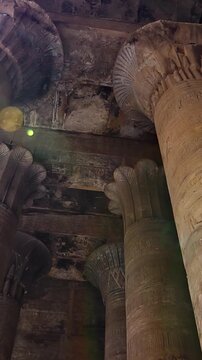 Temple of Edfu with massive carved columns and detailed hieroglyphs, revealing the atmosphere of Ancient Egyptian architecture and sacred space. Egypt