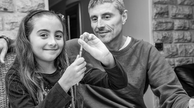 Family bonding moment with father and daughter playing