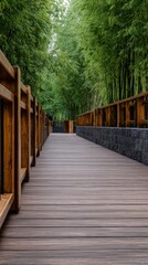 Obraz premium A serene wooden pathway lined with bamboo, leading through a lush green environment