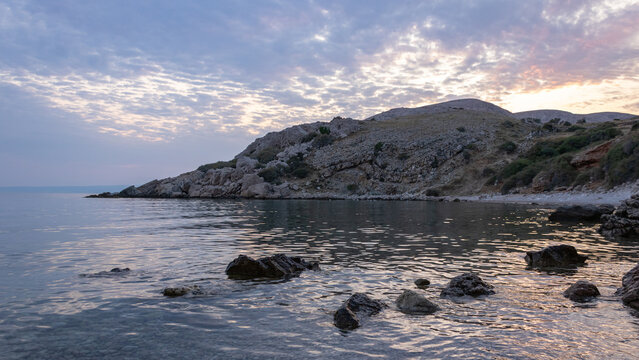 Rocky beach and calm Adriatic Sea at sunset near Stara Ba&scaron;ka, Krk Island, Croatia