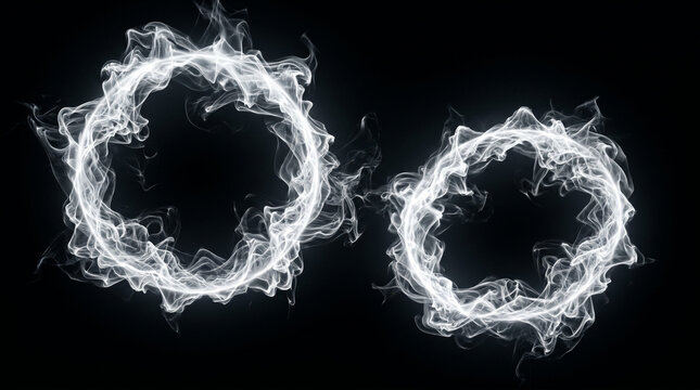 Two white smoke rings circling on black backdrop.