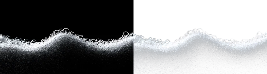 Foam curls form on the surface of liquid with bubbles floating in clear space during a close-up shot © Liubov