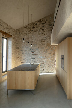 A beautiful, spacious kitchen right in the middle of the room.