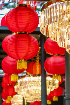 Street is decorated with Chinese red paper lanterns and glass chandeliers. Chinese paper lantern. Chinese New Year. National Chinese New Year decorations. Traditional red lanterns on streets