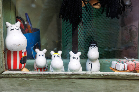 Tallinn, Estonia, August 31, 2024. Moomin character figurines and collectible decorations displayed in a souvenir shop window. 
