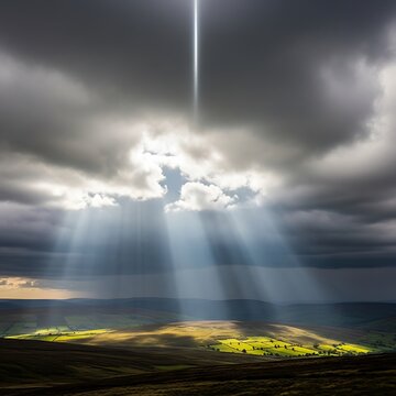 Sunbeam Breaking Through Dark Cloud Cover Over Landscape.