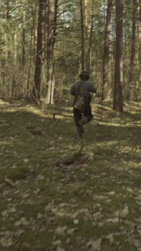 Group Of Soldiers With Carabines Mauser 98k Sneaking Through Forest. Wermacht Military Uniform. Soldier Aiming From Rifle. Reenactors Dressed As German Infantry Soldiers Make War Ambush In Forest