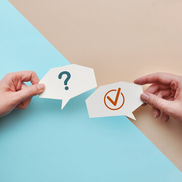 Question and Check Mark Speech Bubbles Representing Decision Making