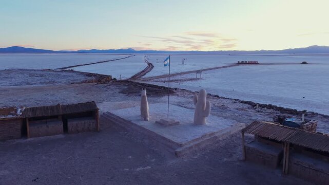 Drone aerial video of roadside viewpoint and white salt flat landscape in Salinas Grandes, Argentina.