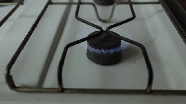 Gas stove with blue flame, the concept of energy crisis and lack of heating and resources