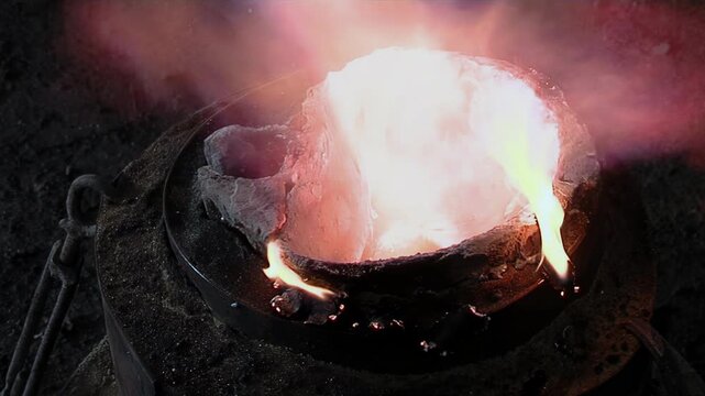 Flames And Smoke Bursting From Incandescent Bell Mold In Metal Workshop - 4K