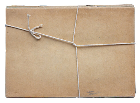 Pile of vintage cardboard notebooks tied with white string and isolated on white