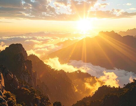 Golden sunbeams pierce through clouds over majestic mountain peaks at sunrise.