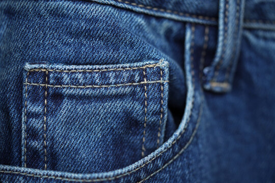  blue jeans. Front pocket and small pocket pants with seam of fashion design. close up, macro. concept business, shopping, sale. Design detail, button and seams, copy space