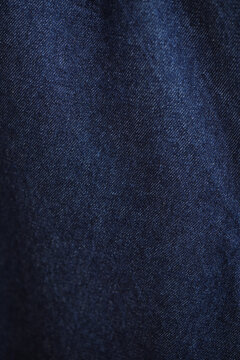 Blue denim jeans texture as background. close up, macro. concept business, shopping, sale. Design detail, copy space