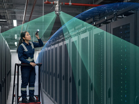 Technician Inspecting Server Room Suppression Nozzle