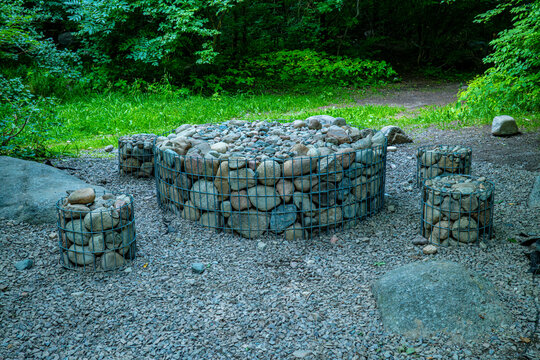 Stone picnic table and chairs set in outdoor forest park area, natural rustic recreation and leisure concept