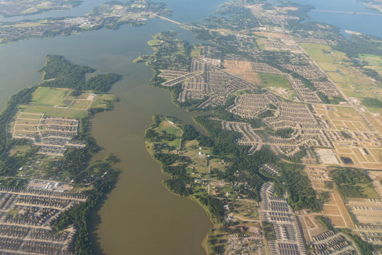 Texas Sprawl: High-Altitude Aerial View of Lewisville Lake and Surrounding Residential Subdivisions near Dallas, Texas