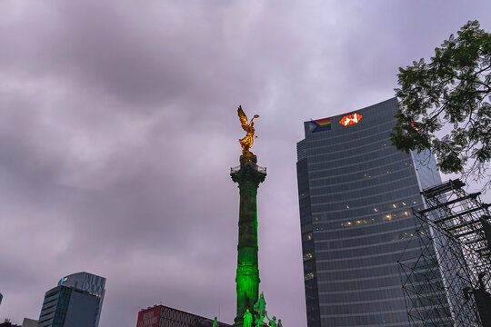Twilight Landmark: Dusk View of the Angel of Independence Monument and Modern Skyscrapers along Paseo de la Reforma, Mexico City