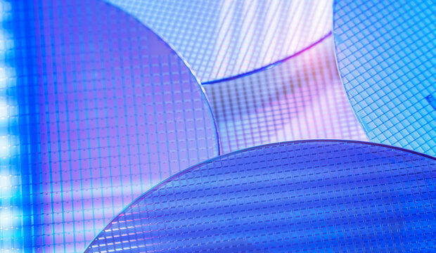blue silicon wafer for manufacturing semiconductor of integrated circuit.Electronic circuit designs have been built onto the wafers using micromaching including photolithography