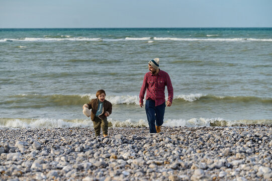Dad and son on the beach