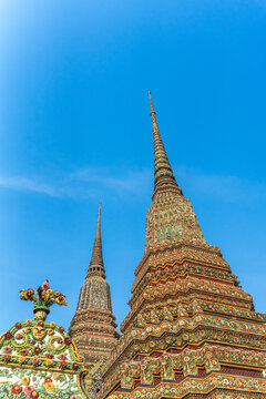 Wat Pho Temple Towers Under Blue Sky in Bangkok City