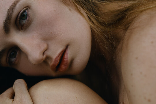 Woman's Close up Portrait with green eyes with heterochromia