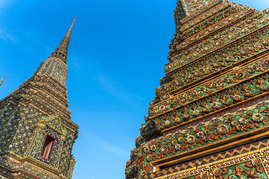 Tall Pagodas in Wat Pho With Bright Blue Sky in the Background