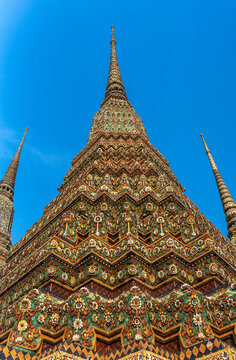 Tall Temple Spires Rise Against Blue Sky in Thailand