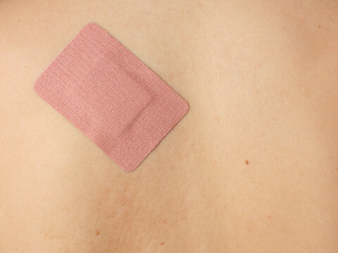 A band aid on someone's back