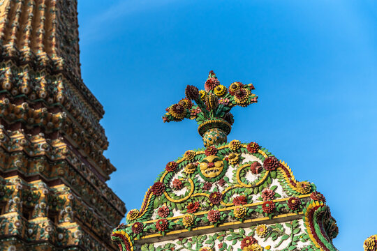 Decorative Design on Temple Against Blue Sky in Thailand
