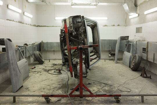 Vehicle Frame Turned on its Side for Metalwork and Rust Repair