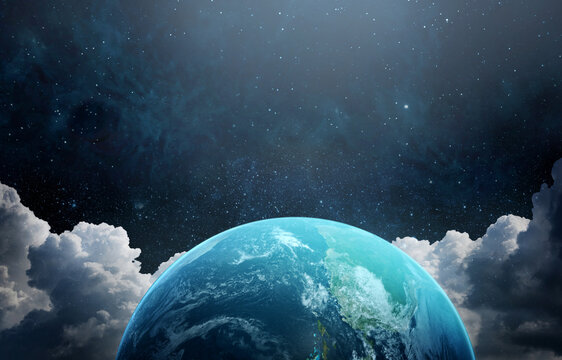 SPlanet Earth viewed from space with glowing sunlight above the horizon and a star-filled sky. .Elements of this image furnished by NASA