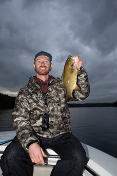 Fisherman portrait  proud  bass  Lake New Hampshire 